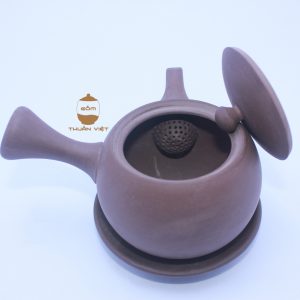 brown teapot horizontal hand