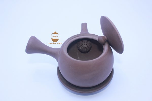 brown teapot horizontal hand